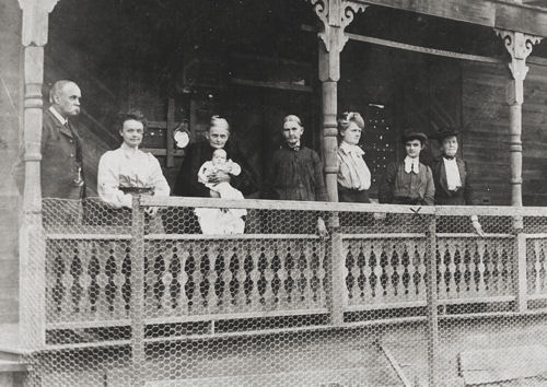 On poach of Casey Boarding House about 1912. Mary is thought to be the blonde woman third from the right. Dovie is the shorter brunette marked wiith the X.
