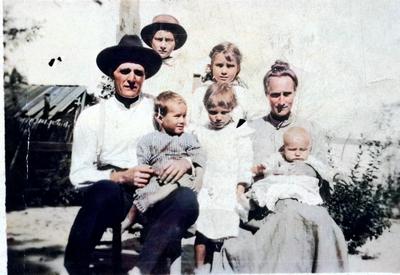 Family of John C Langston and Nancy L Scott Langston. Front l-r is John, on his lap is John Edward, standing in the middle is Lois Estelle, Nancy and on her lap is Mallard. IN the back is Theodore and Clara. Colorized photo.